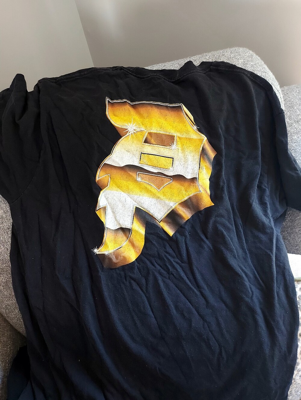 Youth Primitive Black Graphic Tee with Gold & White Lettering